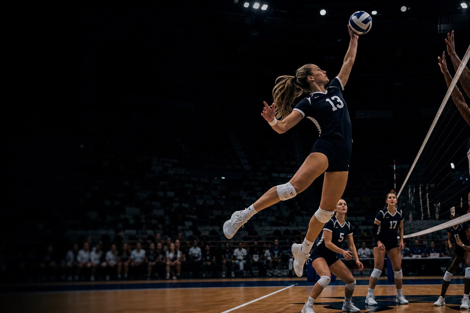 Outside hitter spiking at the net — frozen peak moment, sidelight from the arena
